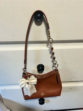 Coach Tan Leather Shoulder Bag with Heart Chain and Bow Charm